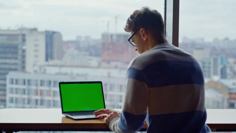 It worker using greenscreen computer swiping pc at panoramic workplace closeup Stock Footage 335246677