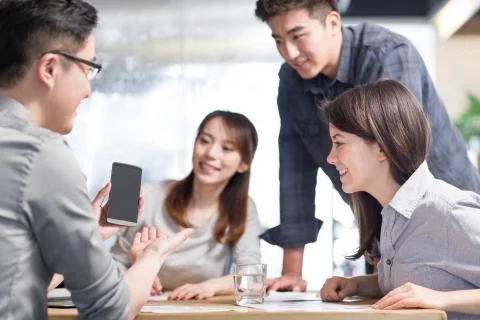 IT workers developing smart phone Stock Photos