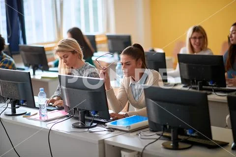 IT workshop at university. Girl on class with computer. Stock Photos