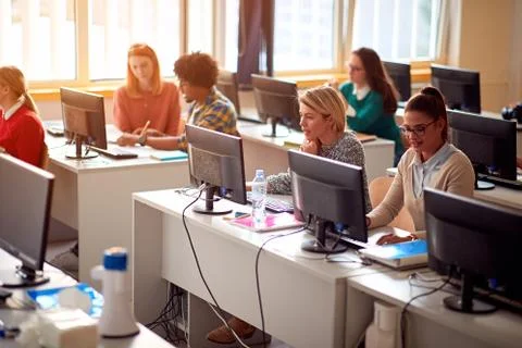 IT workshop at university. Group of Students on class with computer. 스톡 사진