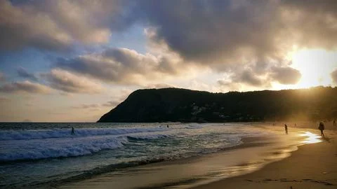 Itacoatiara Beach Sunset w/ Clouds Stock Photos