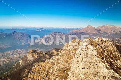 Italian alps surround the lake of Como Stock Photos
