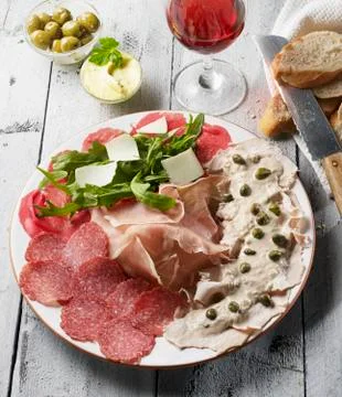 An Italian appetiser platter featuring Parma ham, Vitello tonnato, Carpaccio, Stock Photos