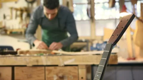 Italian artisan working in lutemaker workshop Video stock 8975433