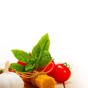 Italian basic pasta fresh ingredients cherry tomatoes garlic and basil 스톡 사진