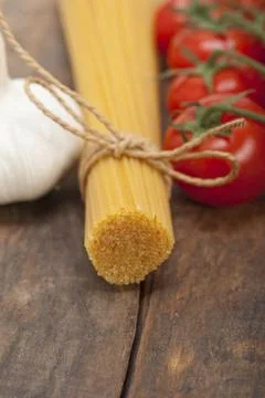 Italian basic pasta fresh ingredients cherry tomatoes garlic, food photography Stock Photos