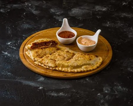 Italian calzone on the table Stock Photos