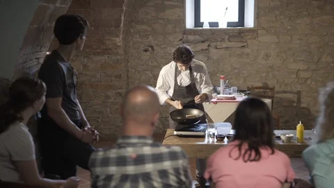 Italian Chef Demonstrating To Trainees How To Cook A Pasta Dish  in Stock Footage 104186723