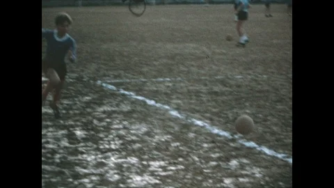 Italian Child Plays Football on a Soccer Field in a Vintage Footage Stock Footage