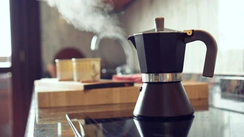 Italian coffee pot boiling on the kitchen marble. Boiling point by steaming 스톡 동영상 130867045