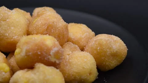 Italian deep fried cake with custard on black background Stock-Footage 138464657