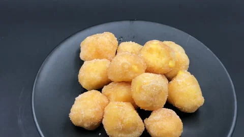 Italian deep fried cake with custard on black dish background Stock-Footage 138464779
