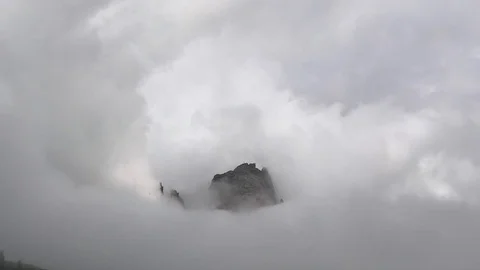 Italian Dolomites in clouds. Timelapse of clouds rolling through rocky mountains Video stock 115543923