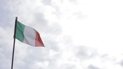 Italian flag blowing in the wind with clouds Stock Footage 144760200