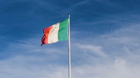 Italian flag flapping in blue sky Stock Footage 95890909