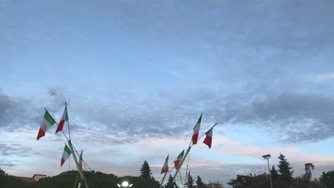 Italian flags waves at sunset in a Luna Park in Scandicci, Florence. Stock Footage 121933320