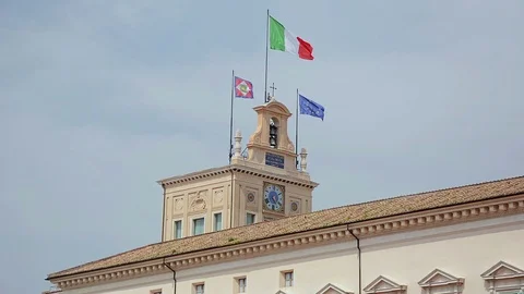 Italian Flags waving in the wind at Quirinal palace rooftop in Rome, Italy Stock Footage 92965723