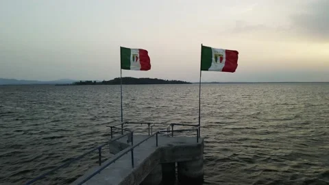 Italian flags in the wind by a lake Stock Footage 159059444