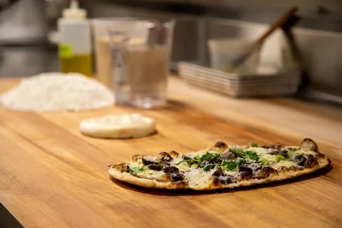 Italian Flat Bread Pizza on Chef Table Stock Photos