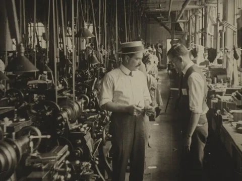 Italian man talks with a worker inside the factory - 1920 Stock Footage 95144746