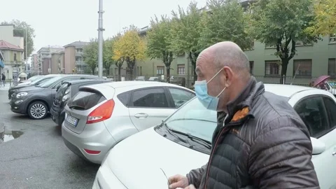 Italian Man Walking at City While Wears Medical Mask During Covid-19 Pandemic Stock-Footage 141386483