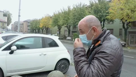 Italian Man Walking Outside While Wears Medical Mask During Covid-19 Pandemic Stock Footage 141383184