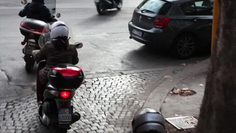 Italian mopeds scooters vespas taking off driving shot from high vantage point Stock Footage 252147146