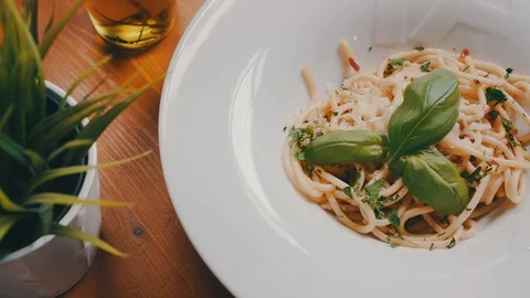 Italian pasta on table in restaurant. Italian food, meal, lunch, cuisine, plate. Stock Footage
