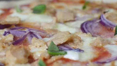 Italian pizza adding basil on the top Stock Footage 130909793