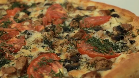 Italian pizza rotating with tomato Stock-Footage 80649110