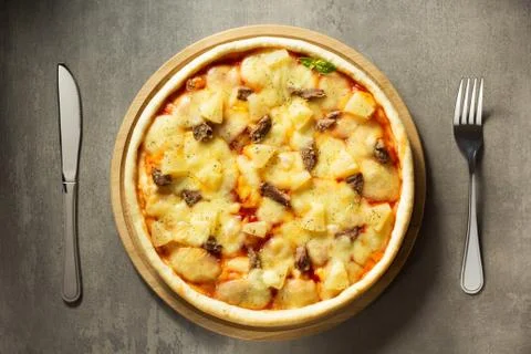 Italian pizza at table surface Stock Photos