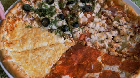 Italian pizza on a thin dough assorted. Pizza four seasons. Stock Footage 154000267