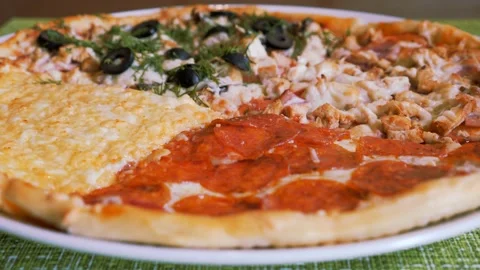 Italian pizza on a thin dough assorted. Pizza four seasons. Stock Footage 155073082