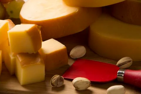 Italian provolone on wooden board Stock Photos