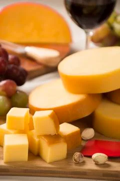 Italian provolone on wooden board Stock Photos