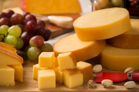 Italian provolone on wooden board Stock Photos