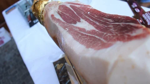 Italian raw ham ready to be cut with a knife Video stock 109280699