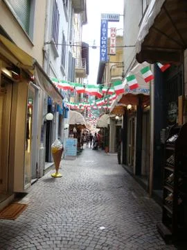 Italian street with flags Stock Photos