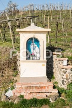 Italian traditional votive temple in the countryside dedicated to the Virgin Stock Photos