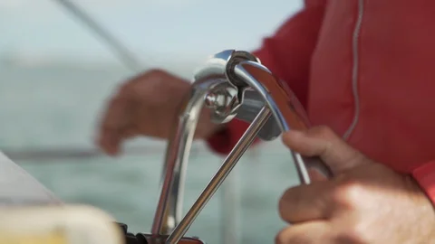 Italy 014 Close Up on Hands Steering Small Boat Stock Footage 129478199