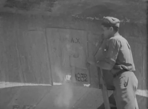 ITALY - 1944: Machine shop - Workman at the curved flank of a huge metal vessel Stock Footage 344485826