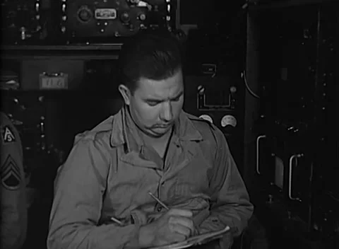 ITALY - 1944: Operations notes - Soldier records radar notes on knee pad Stock Footage 344903228