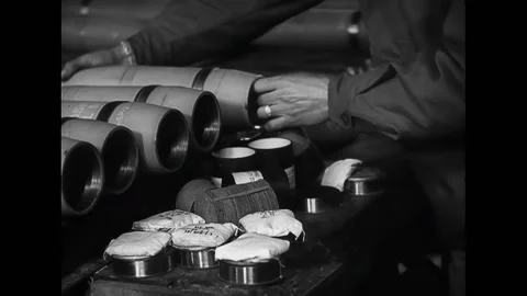 ITALY - 1945 - Soldiers load shells with propaganda leaflets on a conveyor Stock Footage 296691322