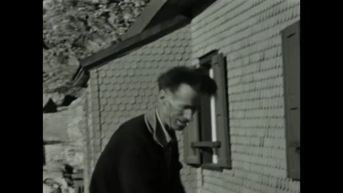 Italy 1955, Grumpy Man Organizing Home Video stock 265196658