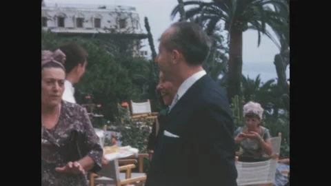 Italy 1969, Elegant cocktail party outdoor in 60's Stock Footage