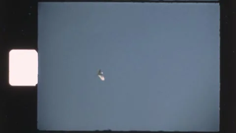Italy 1970s, unidentified flying objects filmed against open sky Stock Footage 339429177