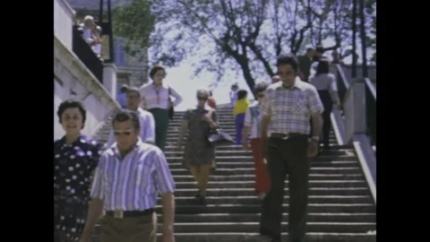 Italy 1975, Urban Vibes: People Descending Staircases in 1970s Rome Stock Footage 242288606