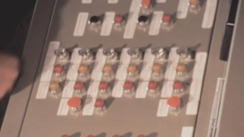 Italy - 1980: Worker switches button of vintage industrial machine Stock Footage 172138712