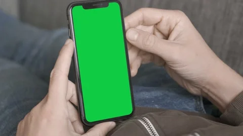 Italy - 2020: Single Tapping and Holding a Green Screen iPhone Stock Footage 162175490