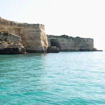Italy, Apulia, Lecce Province, Otranto, Baia Del Mulino D'acqua, Cliffs on sea Stock Photos